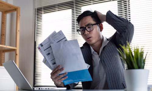 financial-problem-concept-young-asian-man-is-stressed-overthink-by-debt-from-many-credit-cards-bills-man-figured-out-way-out-debt-hand_35150-1705